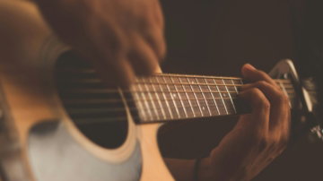 person playing guitar